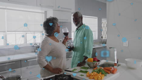 Animation-of-network-of-connections-with-icons-over-senior-african-american-couple-drinking-wine