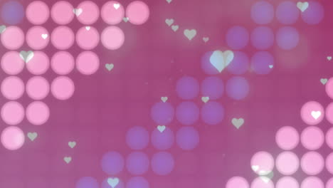 Animation-of-falling-hearts-over-colourful-spots