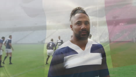 Animation-of-biracial-male-rugby-player-in-rugby-pitch-over-flag-of-france