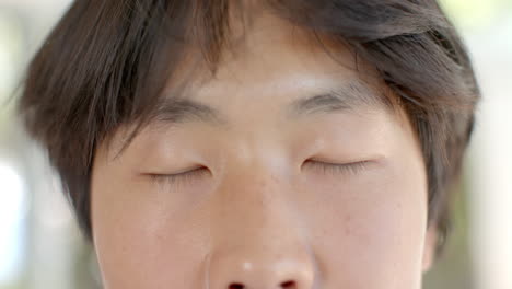 Close-up-of-a-teenage-Asian-boy's-face