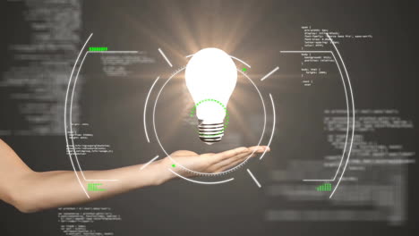 Animation-of-scope-scanning-and-data-processing-over-hand-holding-light-bulb-on-black-background