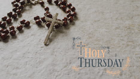 Animation-of-holy-thursday-text-over-christian-rosary-on-grey-background