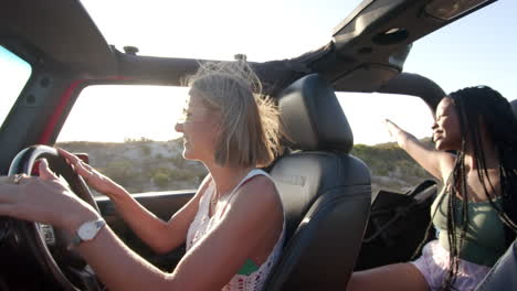 Young-Caucasian-woman-drives-a-convertible-on-a-road-trip
