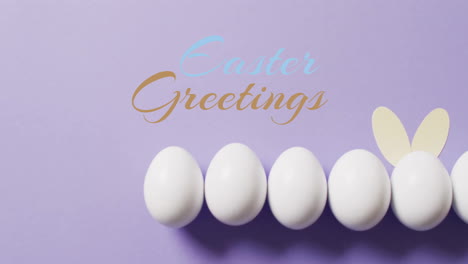 Animation-of-easter-greetings-text-over-white-easter-eggs-on-purple-background