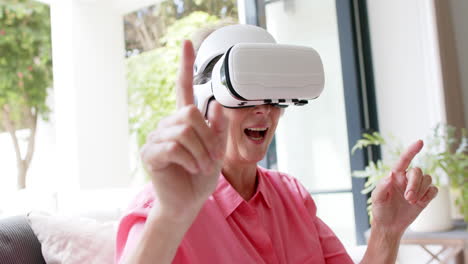 Senior-Caucasian-woman-explores-virtual-reality-at-home