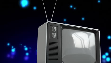Animation-of-tv-over-falling-spots-on-black-background