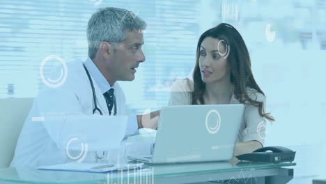 Animation-of-data-processing-over-diverse-doctors-using-laptop