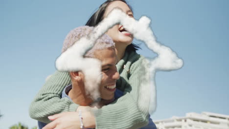 Animation-of-cloud-house-icon-over-happy-biracial-man-carrying-his-girlfriend-piggyback