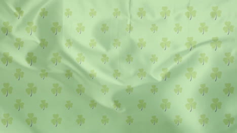 Animation-of-shamrocks-over-green-background