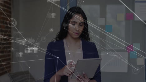 Animation-of-data-processing-and-connections-over-caucasian-businesswoman-using-tablet
