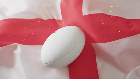 Animation-of-confetti-over-white-rugby-ball-over-flag-of-england