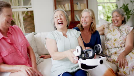 Senior-diverse-group-of-women-share-a-joyful-moment-at-home