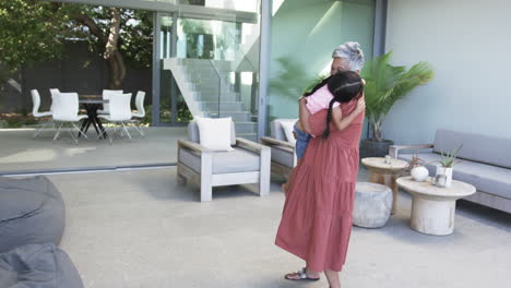 Biracial-grandmother-embraces-a-biracial-granddaughter-in-a-heartfelt-hug-with-copy-space
