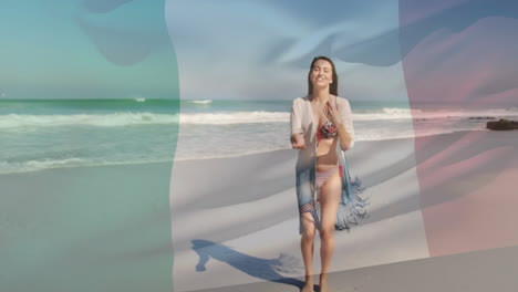 Animation-of-flag-of-italy-over-caucasian-woman-at-beach