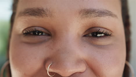 Close-up-of-a-young-biracial-woman-smiling