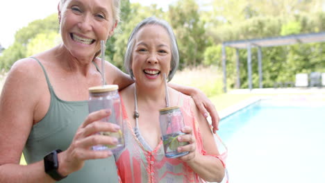 Senior-Caucasian-woman-and-Asian-woman-are-smiling-outdoors