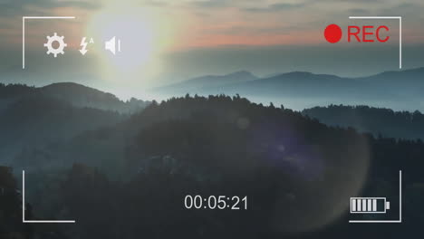 Animation-Der-Schnittstelle-Einer-Digitalen-Videokamera-über-Dem-Hintergrund-Einer-Sonnenuntergangslandschaft