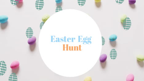 Animation-of-easter-egg-hunt-text-over-colourful-easter-eggs-on-white-background