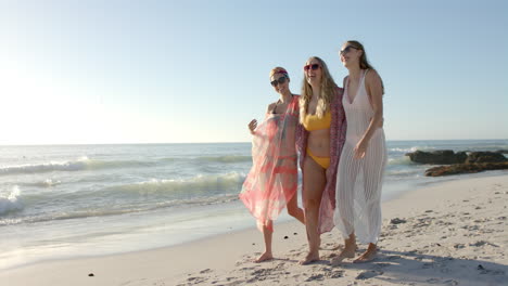 Three-young-women-enjoy-a-sunny-beach-day