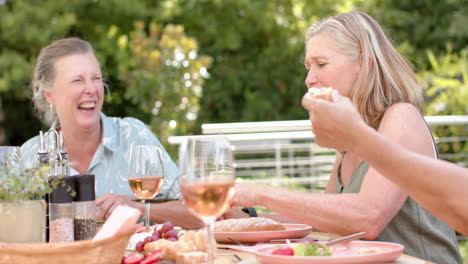 Senior-Caucasian-women-enjoy-a-meal-outdoors