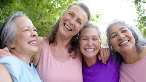 Senior-biracial-woman-and-Caucasian-women-share-a-joyful-moment-outdoors