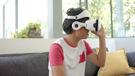 Teenage-Asian-boy-explores-virtual-reality-at-home