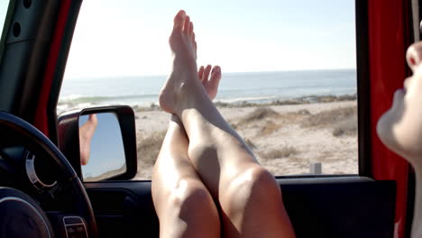 Feet-on-the-dashboard-of-a-car-on-a-road-trip