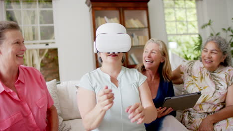 Senior-diverse-group-of-women-enjoy-a-virtual-reality-experience-at-home