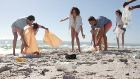 Diverse-friends-participate-in-a-beach-cleanup,-with-copy-space