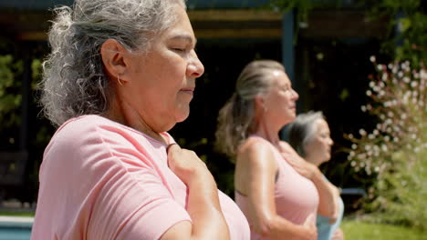 Senior-biracial-woman-practices-yoga-outdoors