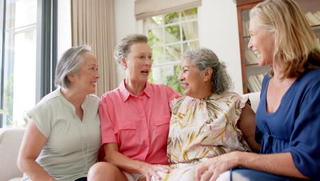 Senior-diverse-group-of-women-share-a-moment-of-joy-indoors