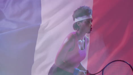 Animation-of-flag-of-france-over-african-american-female-tennis-player-with-tennis-racket