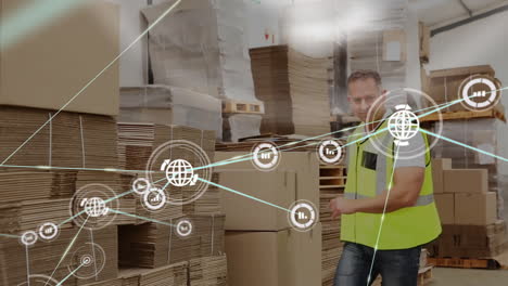 Animation-of-network-of-connections-over-caucasian-male-worker-carrying-cartons-in-warehouse