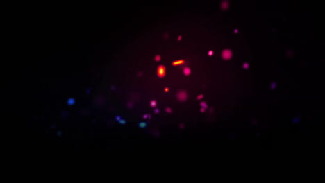 Animation-of-colourful-spots-moving-on-black-background