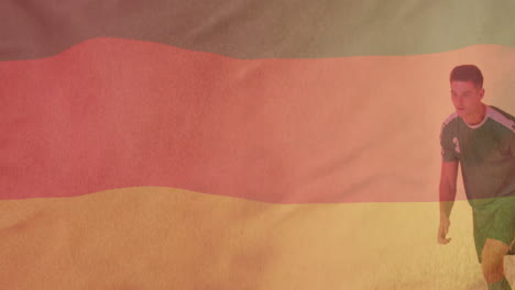 Animation-Der-Flagge-Deutschlands-über-Einem-Kaukasischen-Männlichen-Footballspieler,-Der-Einen-Ball-Tritt
