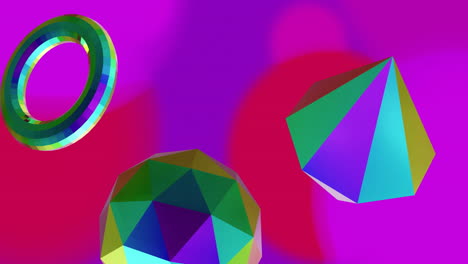 Animation-of-reflective-colourful-metallic-3d-shapes-rotating-on-soft-purple-and-red-background