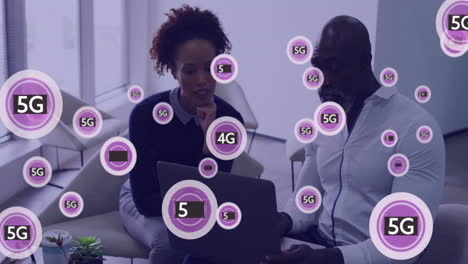 Animation-of-5g,-4g-text-and-data-processing-over-diverse-business-people-in-office