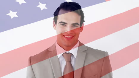 Animation-of-flag-of-usa-over-caucasian-businessman-smiling