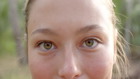 Close-up-of-a-young-Caucasian-woman-with-hazel-eyes-and-a-subtle-smile