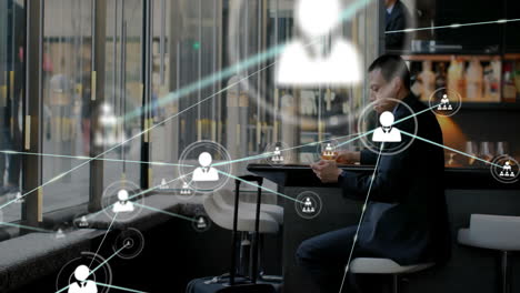 Animation-of-network-of-connections-over-caucasian-man-using-smartphone-in-office