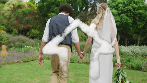 Animation-of-cloud-house-over-happy-diverse-couple-walking-in-garden-on-wedding-day