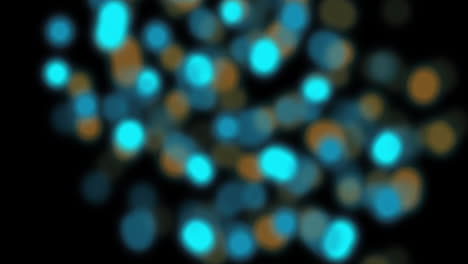 Animation-of-flashing-defocused-orange-and-blue-light-spots-on-black-background
