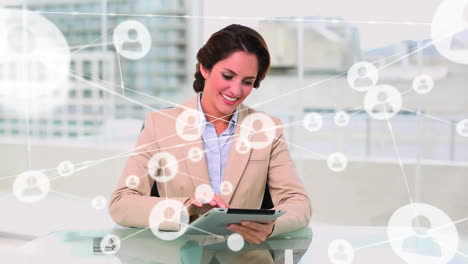 Animation-of-network-of-connections-with-people-icons-over-biracial-businesswoman-using-tablet
