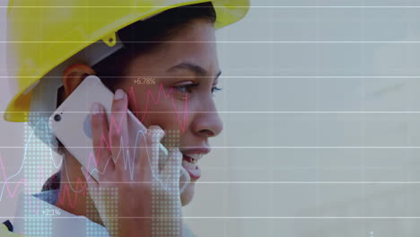 Animation-of-data-processing-and-diagrams-over-biracial-female-worker-talking-on-smartphone