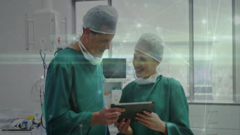 Animation-of-network-of-connections-over-caucasian-doctors-using-tablet-in-hospital