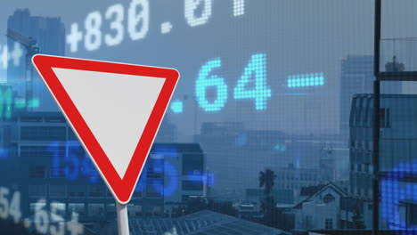 Animation-of-financial-data-processing-over-triangle-road-sign-and-city