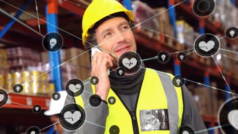 Animation-of-network-of-connections-with-icons-over-diverse-workers-working-in-warehouse
