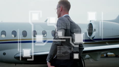Animation-of-shapes-moving-over-caucasian-businessman-at-airport