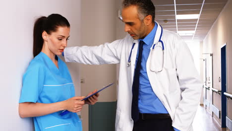 Doctor-interacting-with-nurse