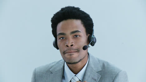 Close-up-of-businessman-talking-on-a-headset